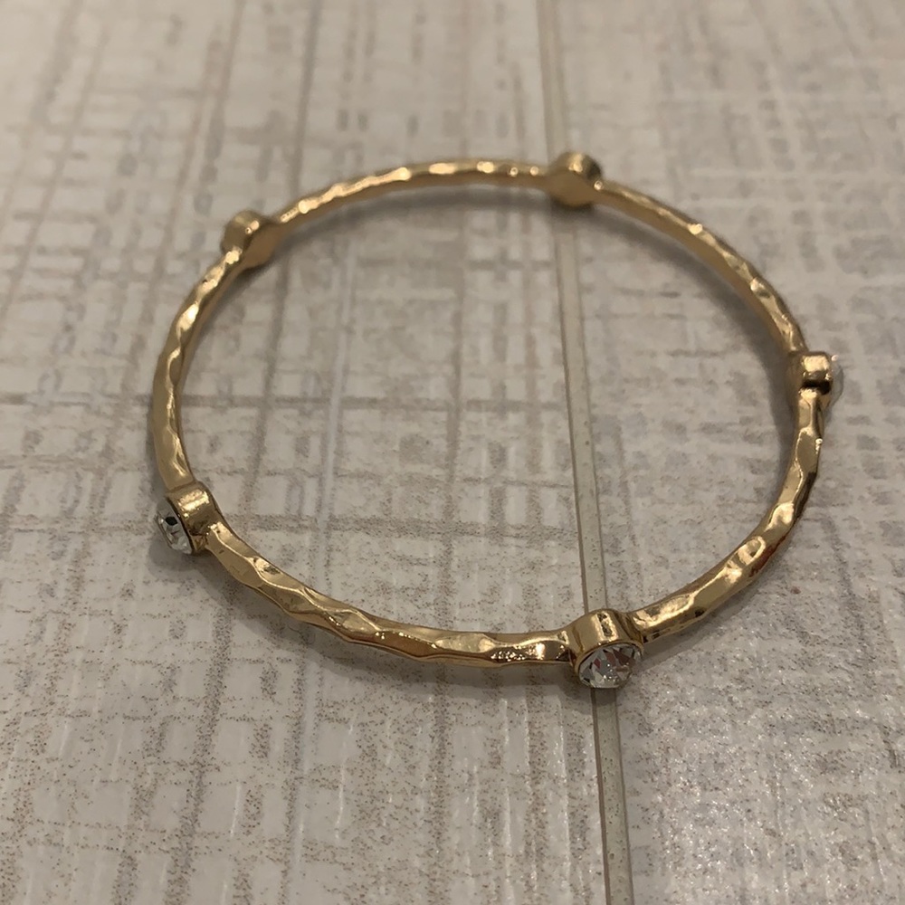 Gold bangle with stones